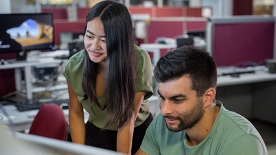 Man and woman looking at computer screen